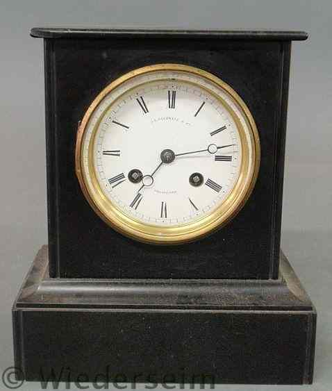 Appraisal: French black marble mantel clock with a white porcelain dial