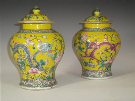 Appraisal: A pair of Chinese yellow ground famille rose jars and