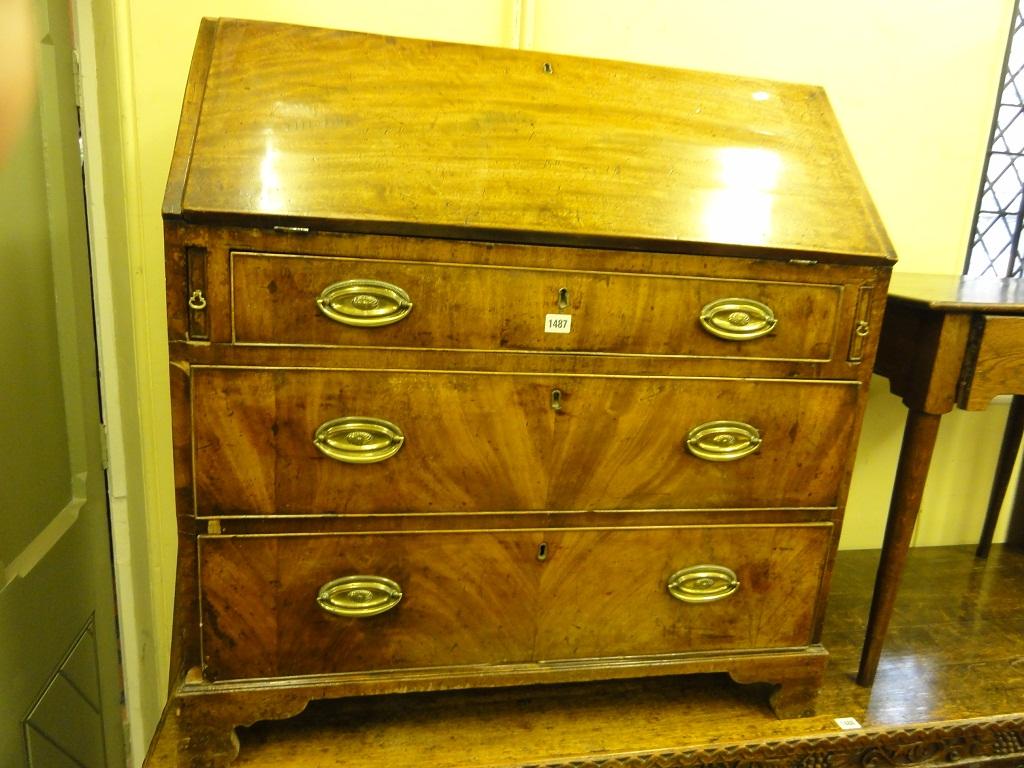 Appraisal: A Georgian mahogany bureau the fall front enclosing a fitted