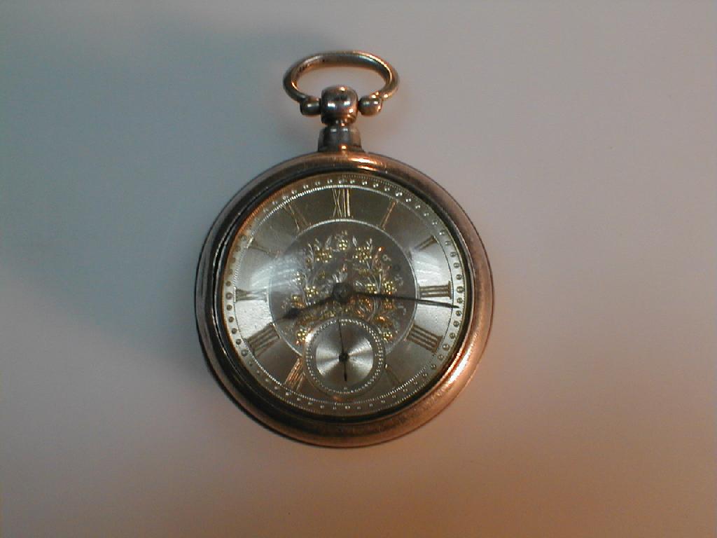 Appraisal: A Victorian silver pair cased pocket watch the silver dial