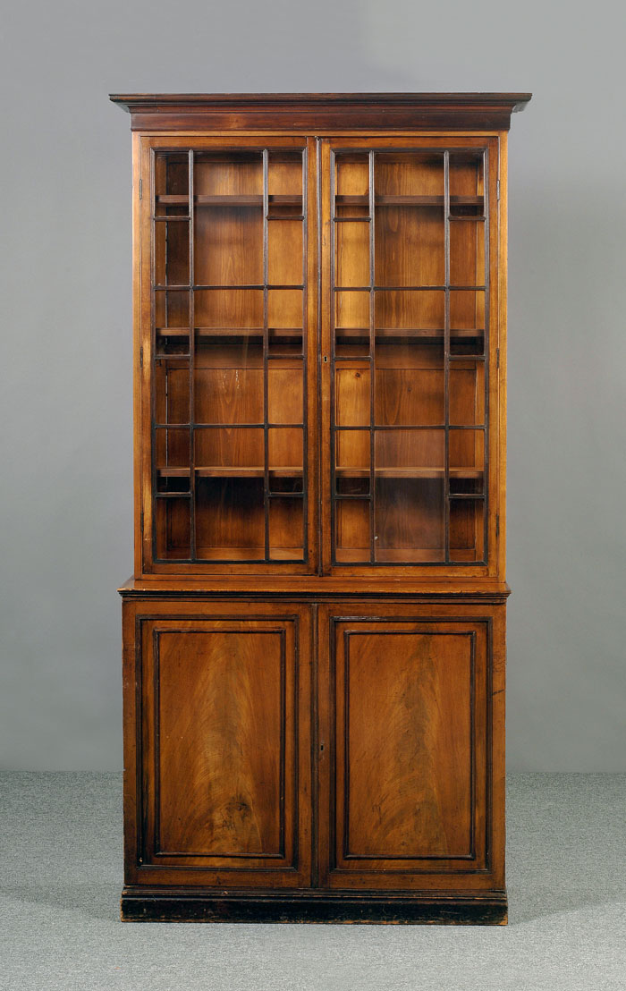 Appraisal: REGENCY MAHOGANY STEP-BACK BOOKCASE The rectangular molded cornice fitted to