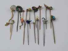 Appraisal: Fifteen gem set stick pins including seven in yellow metal