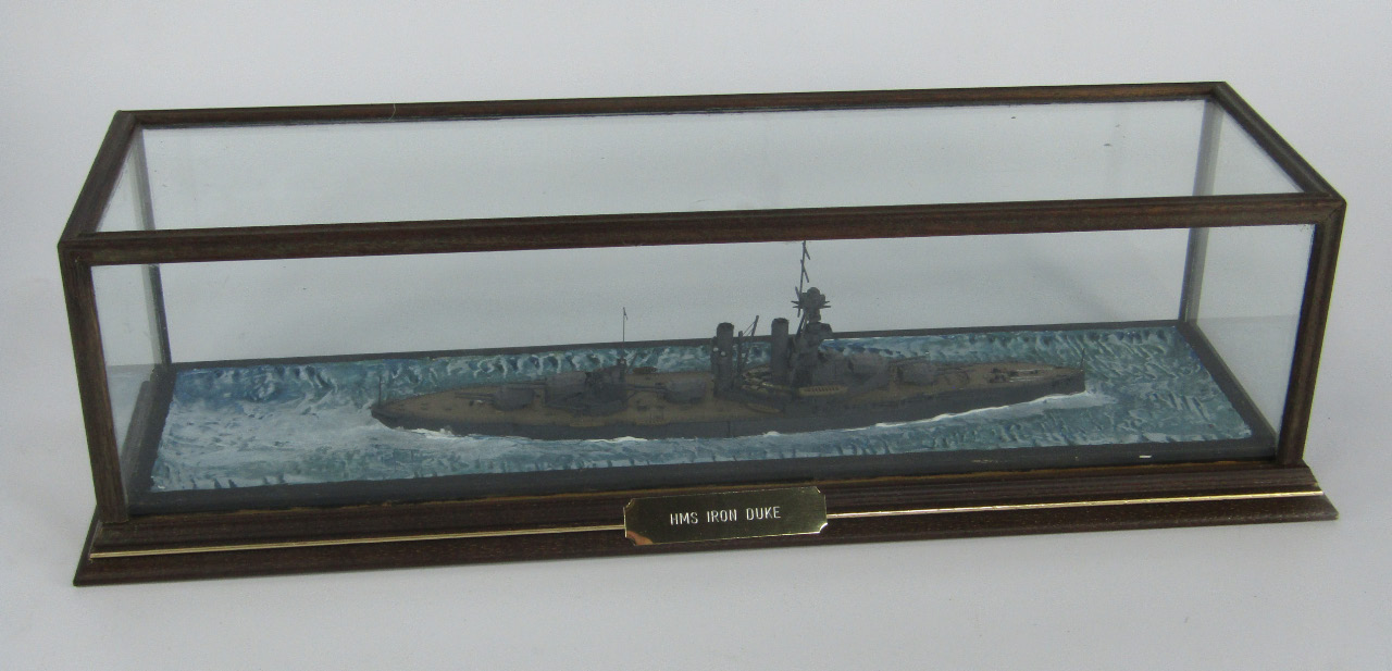 Appraisal: A scale model of the battleship HMS Iron Drake cased