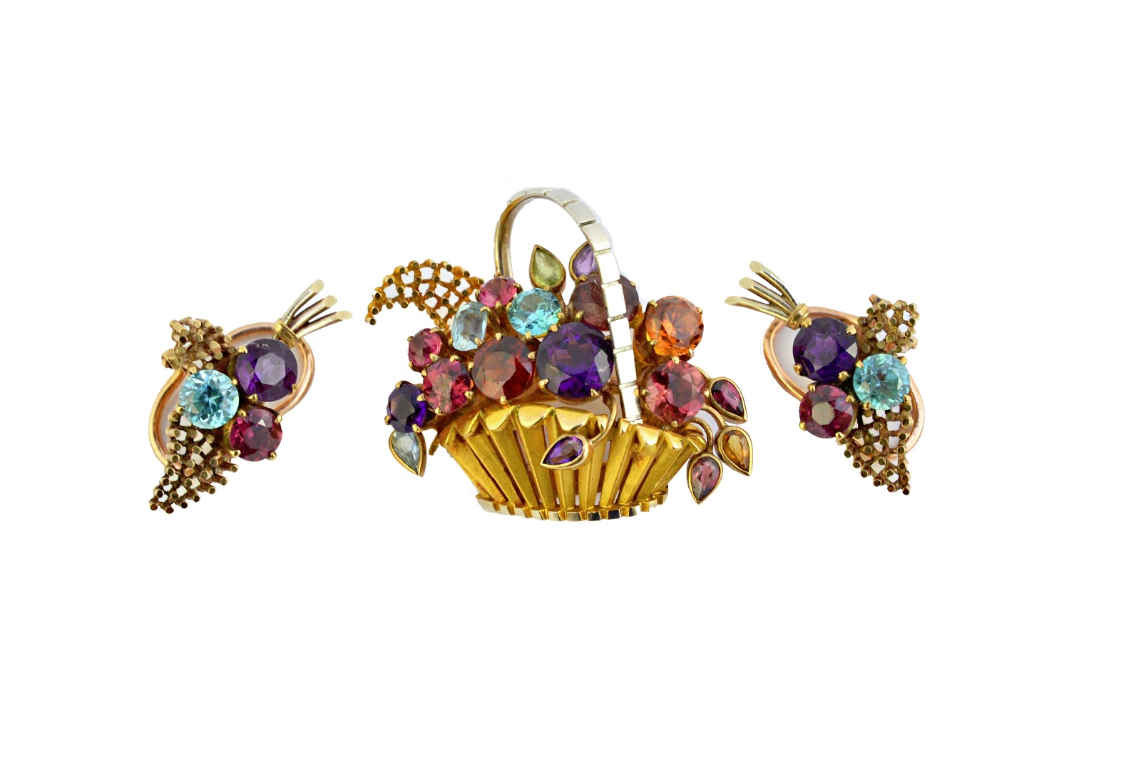 Appraisal: A gold and vary coloured gemstone set brooch designed as