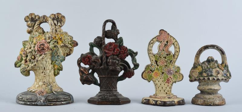 Appraisal: Cast Iron Assorted Mixed Flowers Doorstops Includes mixed flowers in