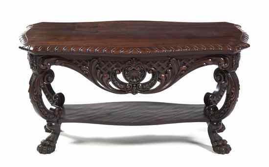 Appraisal: A Rococo Style Carved Mahogany Low Table having a shaped