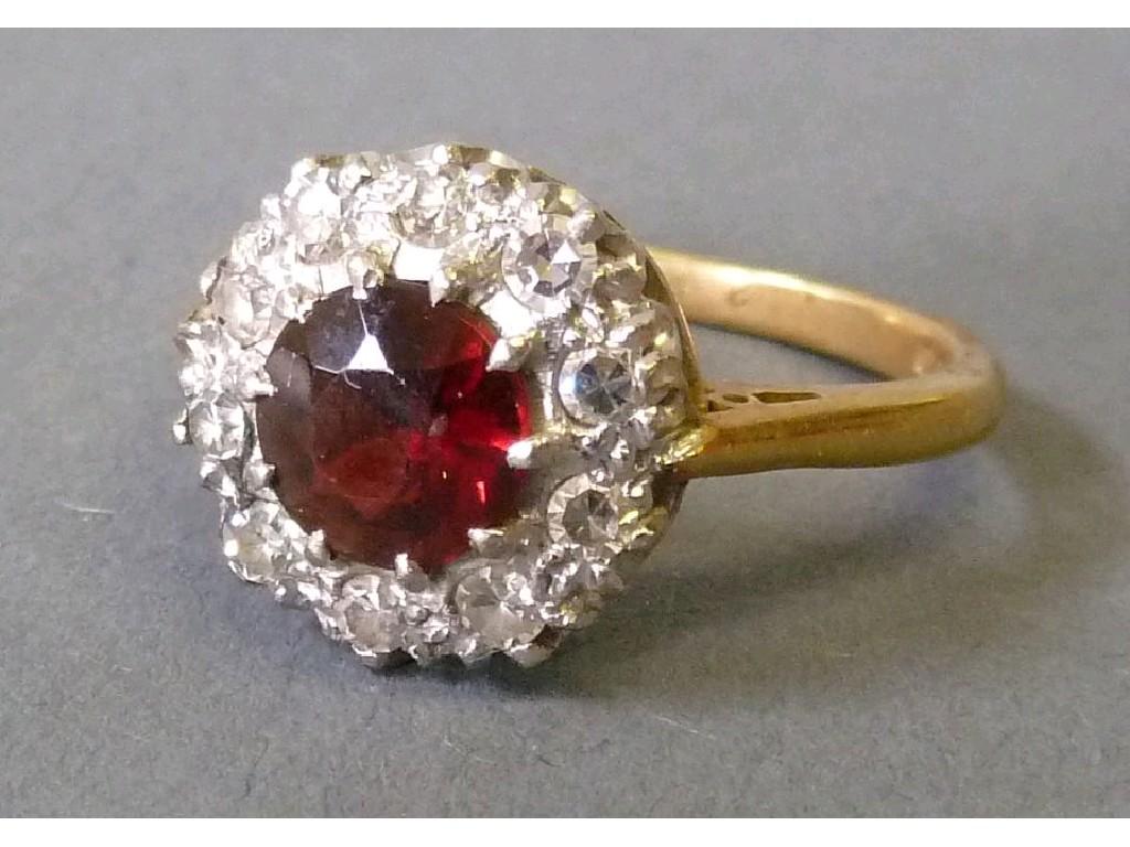 Appraisal: ct GOLD RUBY AND DIAMOND CLUSTER RING set with a