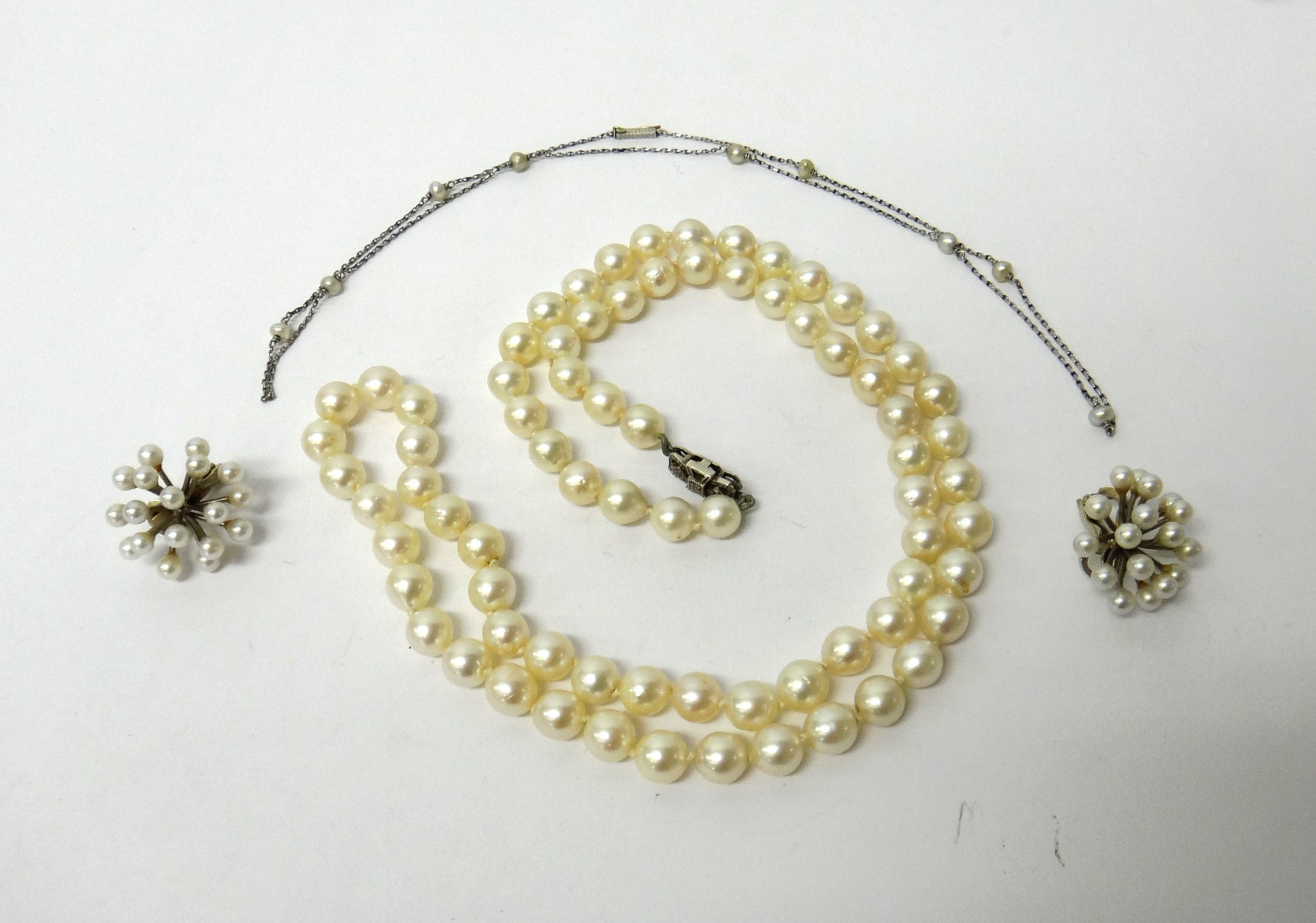 Appraisal: A pair of white gold and cultured pearl cluster earclips