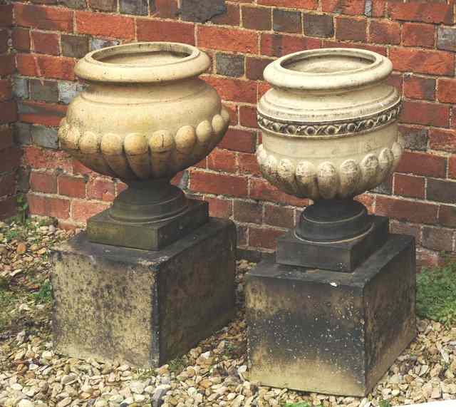 Appraisal: A VICTORIAN TERRACOTTA URN with gadrooned body and on a