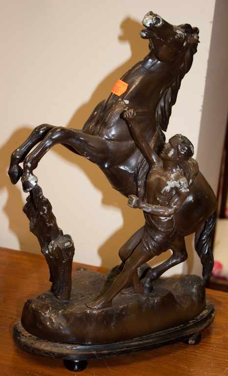 Appraisal: Painted spelter sculpture of a horse tamer Estimate - No