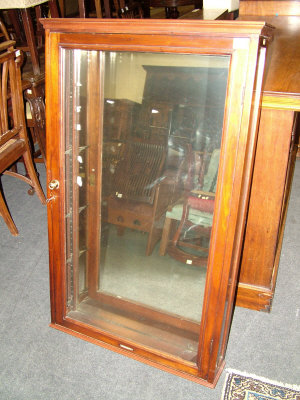 Appraisal: A mahogany glazed wall hanging cabinet late th century the