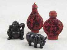 Appraisal: Two Chinese snuff bottles with red lacquer carved scenes each