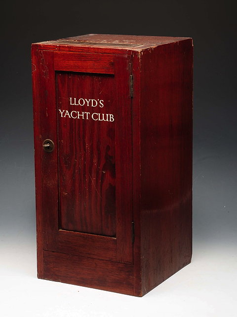 Appraisal: A LLOYD'S YACHT CLUB MAHOGANY LETTER BOX with panel door