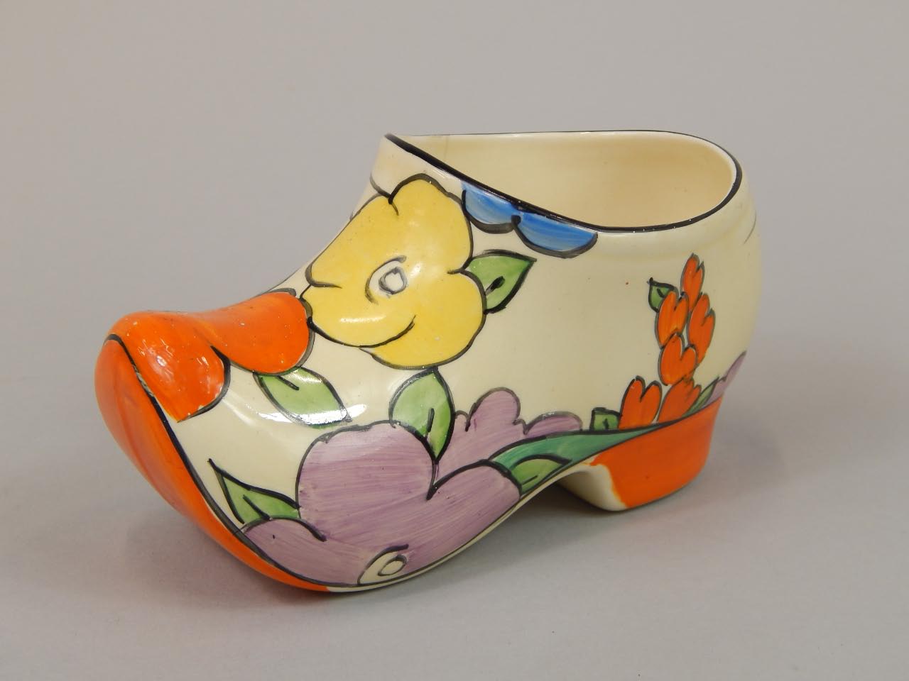 Appraisal: A Clarice Cliff Bizarre ceramic clog decorated with flowers and