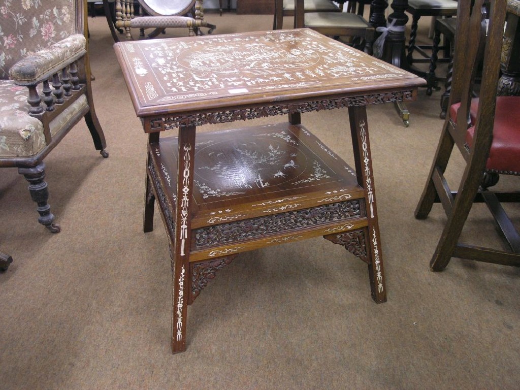 Appraisal: An oriental two-tiered hardwood centre table intricately inlaid with numerous