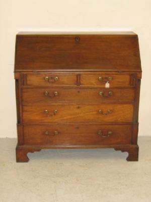 Appraisal: A MAHOGANY BUREAU early th century the fallfront enclosing inlaid