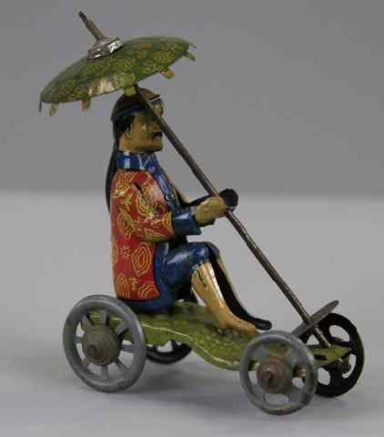 Appraisal: DISTLER CHINAMAN WITH PARASOL PENNY TOY Germany lithographed tin seated