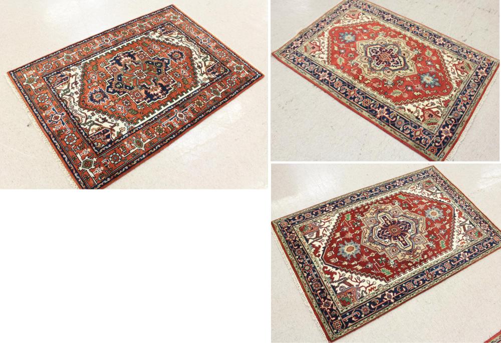 Appraisal: THREE SIMILAR HAND KNOTTED ORIENTAL AREA RUGS Persian Serapi or