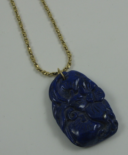 Appraisal: LAPIS LAZULI PENDANT NECKLACE The carved lapis lazuli pendant is