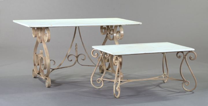 Appraisal: Polychromed Wrought-Iron and Ecru Marble-Top Cocktail Table the four scrolling