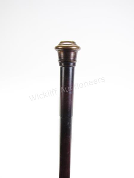 Appraisal: Torch Cane all metal shaft with brass handle shaft separates