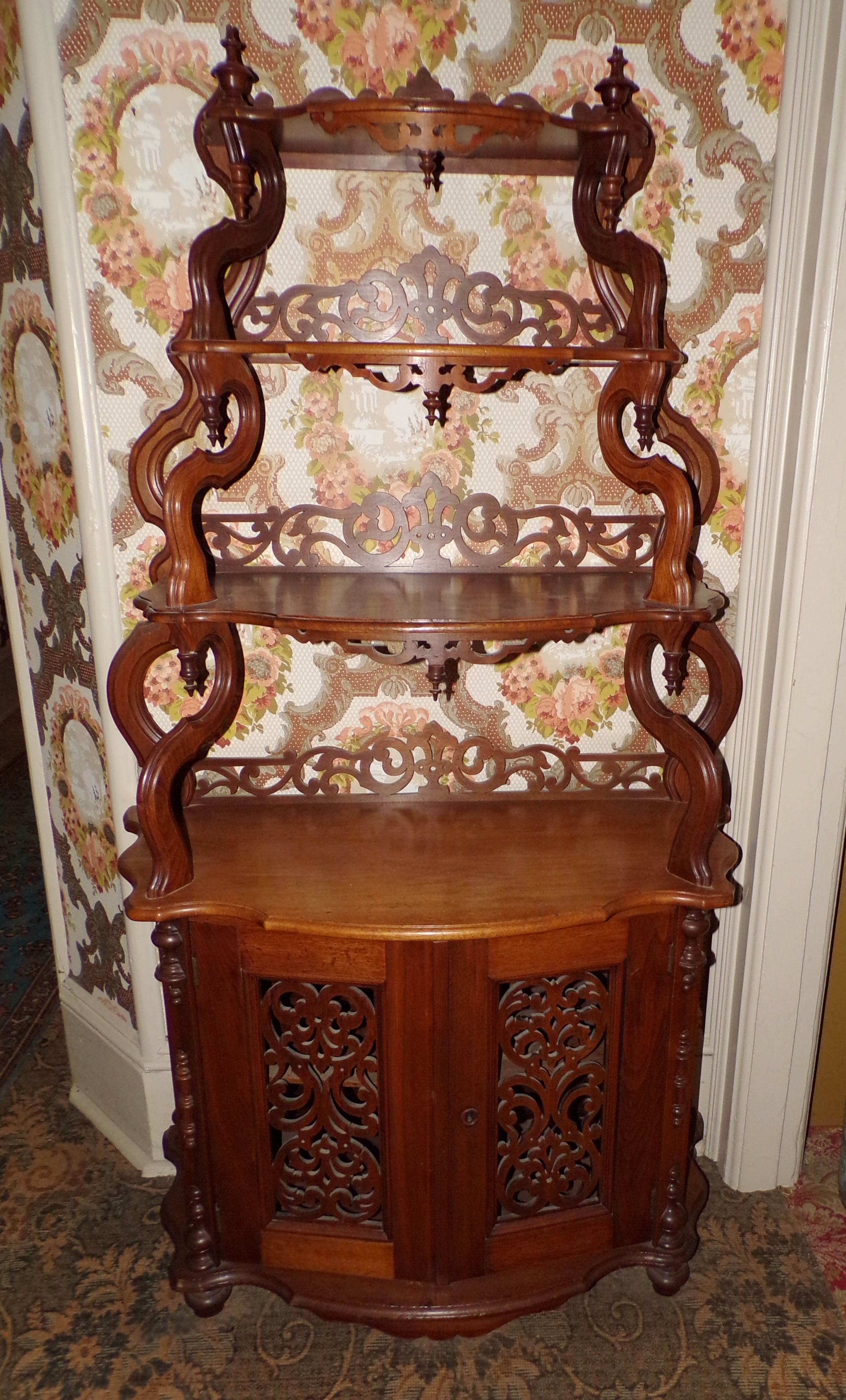 Appraisal: Renaissance Revival walnut etagere with molded and shaped graduated shelves