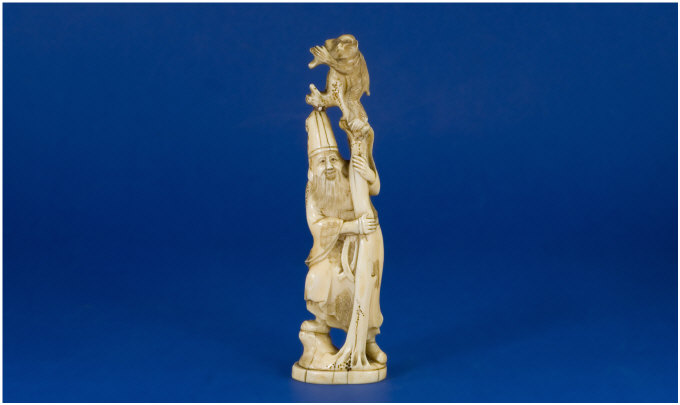 Appraisal: Late th Century Japanese Ivory Figure Magician holding a pole