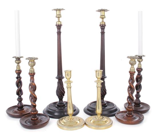 Appraisal: English brass and wood candlestick sets th century two pairs