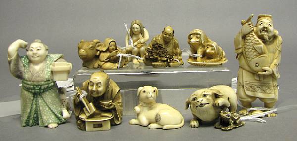 Appraisal: A group of two ivory figural okimono and seven ivory