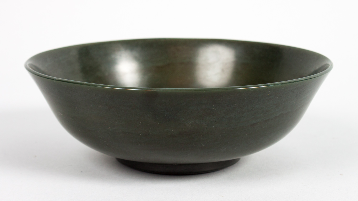 Appraisal: Oriental green jade footed bowl in H in Diam