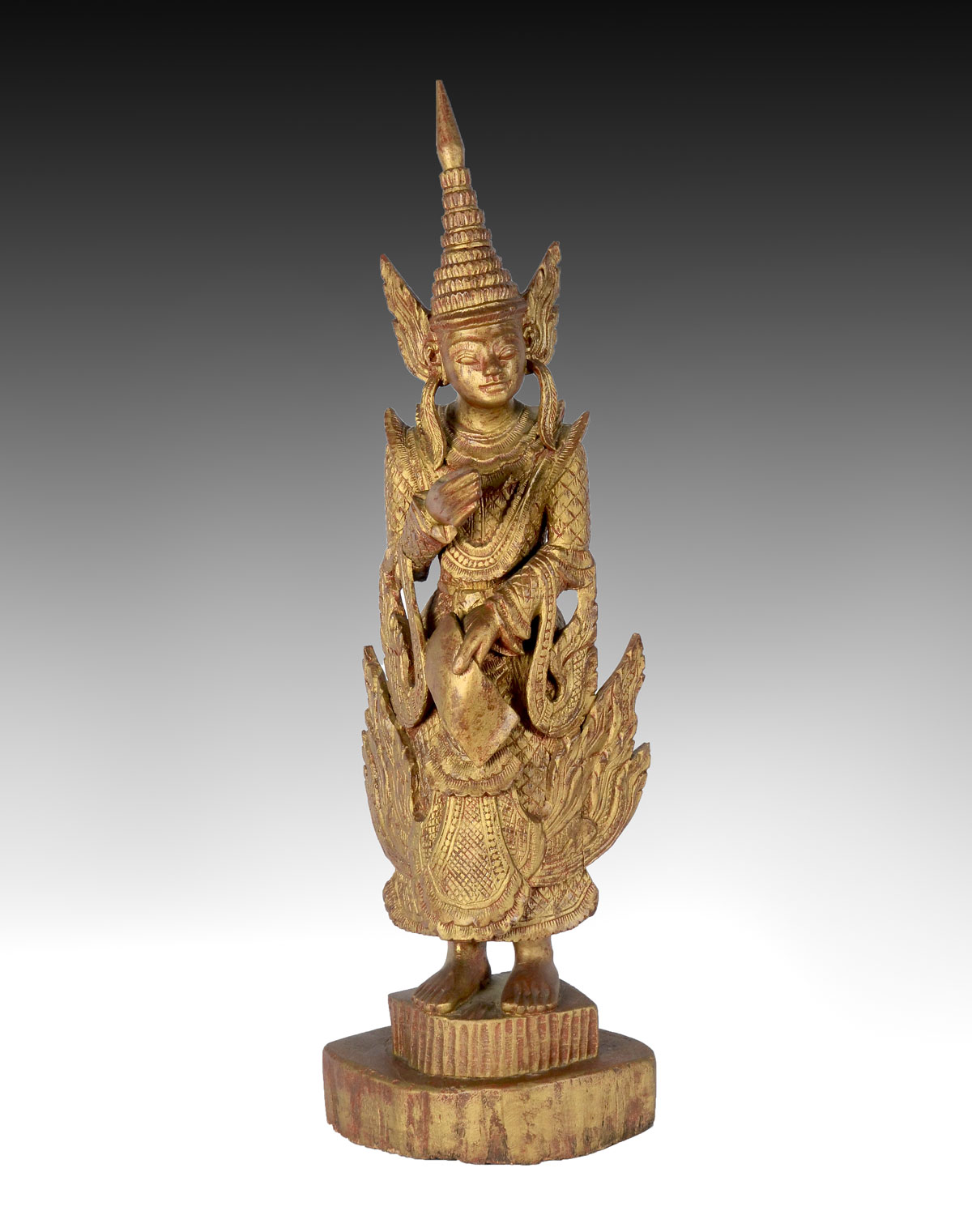 Appraisal: CARVED WOOD THAI FIGURAL STATUE Heavily carved wood Thai god