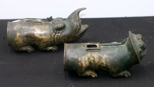 Appraisal: A pair of cast bronze Temple Palanquan handles cast as