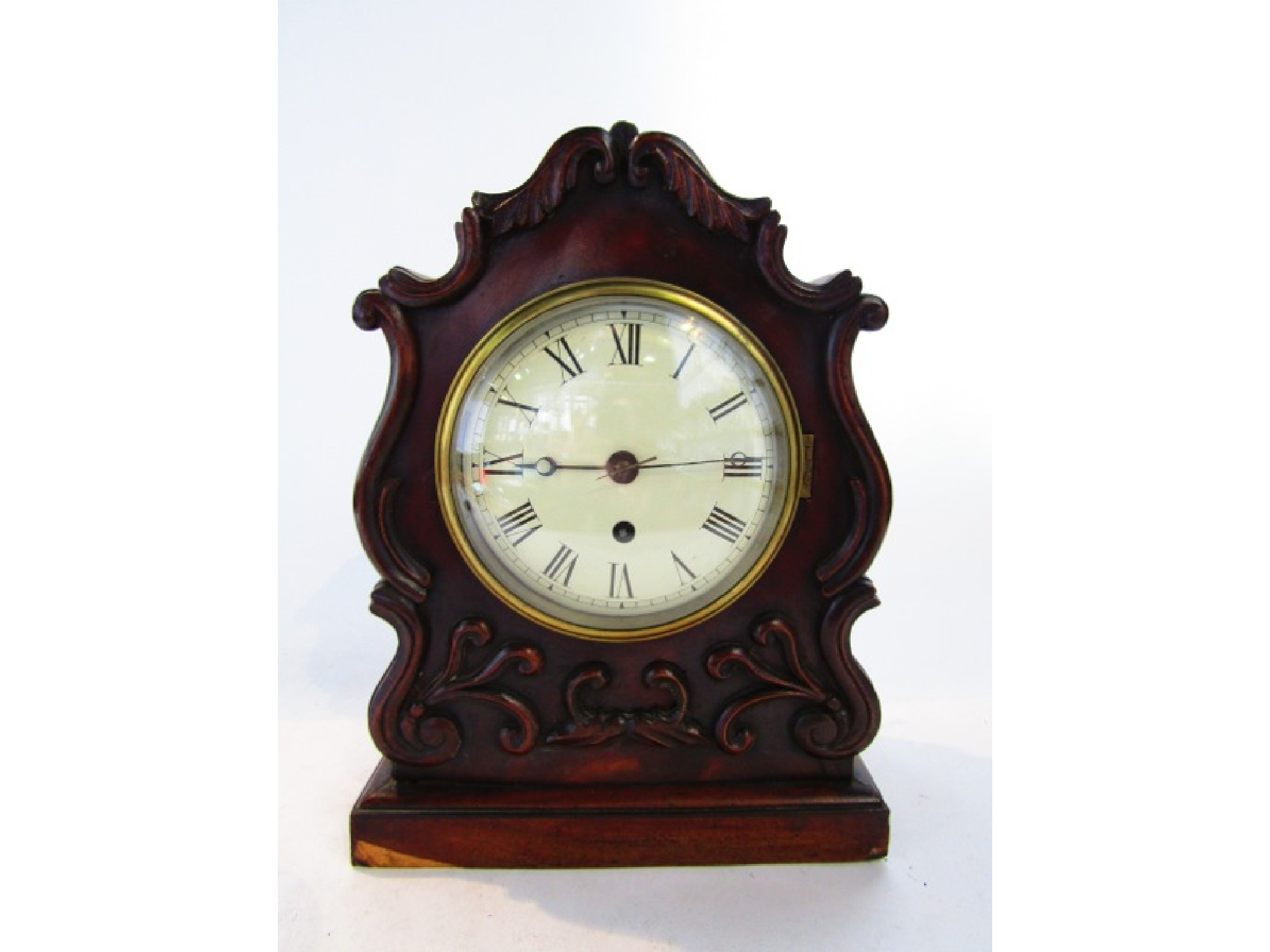 Appraisal: A Regency mahogany mantel clock with shaped case and applied