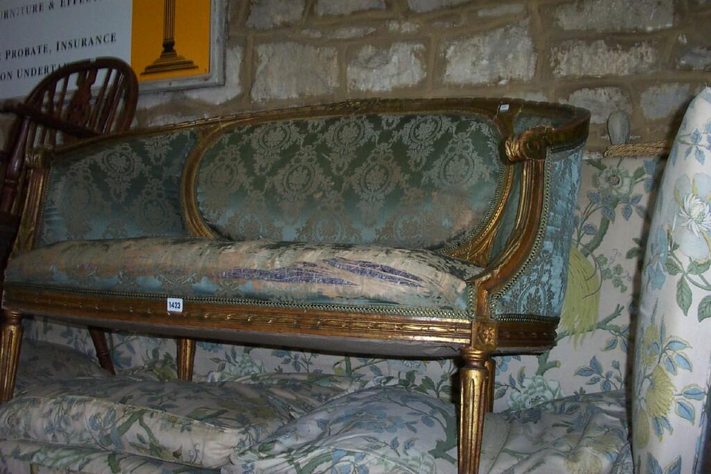 Appraisal: A th century French gilt -seat sofa with upholstered seat