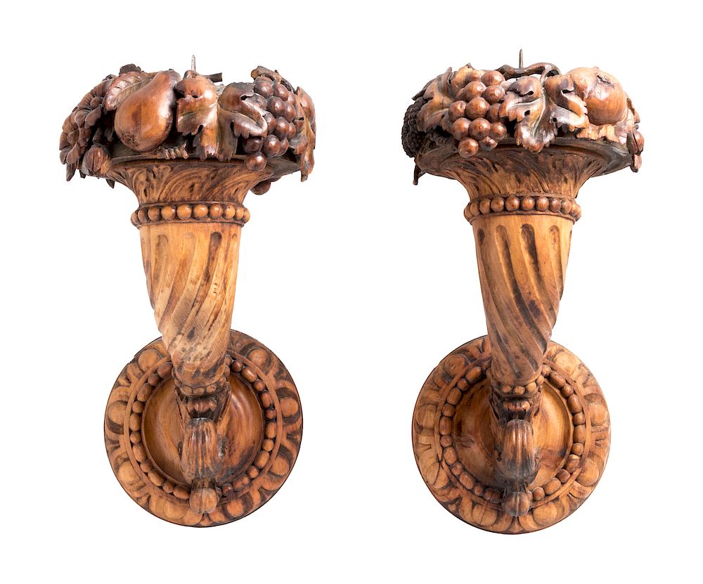 Appraisal: A Pair of Continental Carved Fruitwood Sconces A Pair of