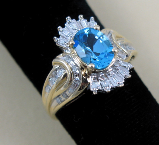 Appraisal: BLUE TOPAZ AND DIAMOND RING K white and yellow gold