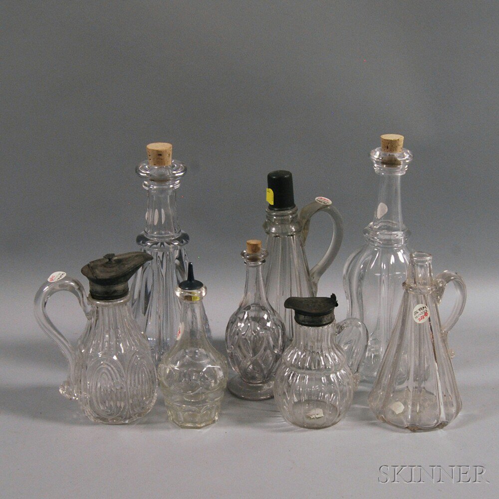 Appraisal: Eight Colorless Blown and Flint Glass Vessels five syrups and