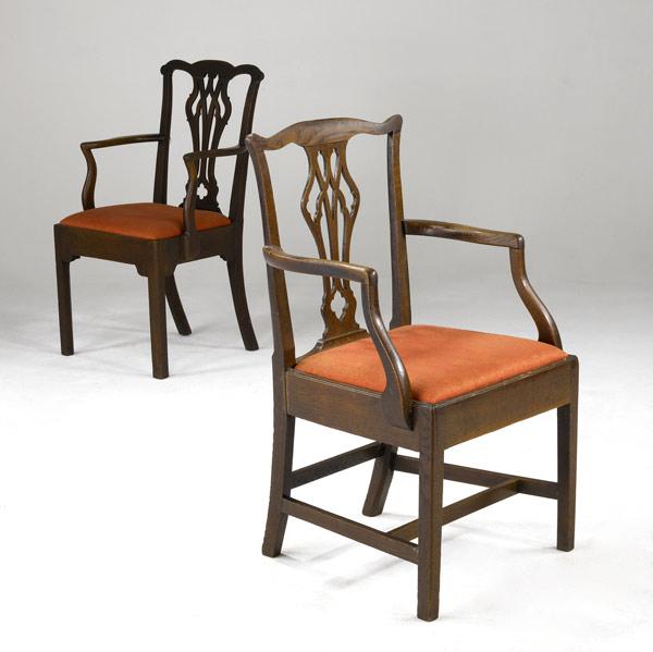 Appraisal: ENGLISH CHIPPENDALE ARMCHAIRS Two carved oak chairs with orange upholstery