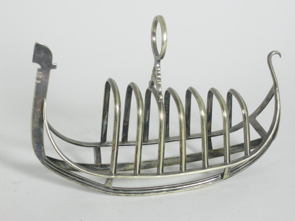 Appraisal: A late th Century Toastrack in the form of a