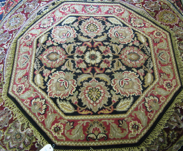 Appraisal: TWO OCTAGONAL AREA RUG Indo-Persians ' and ' diameters