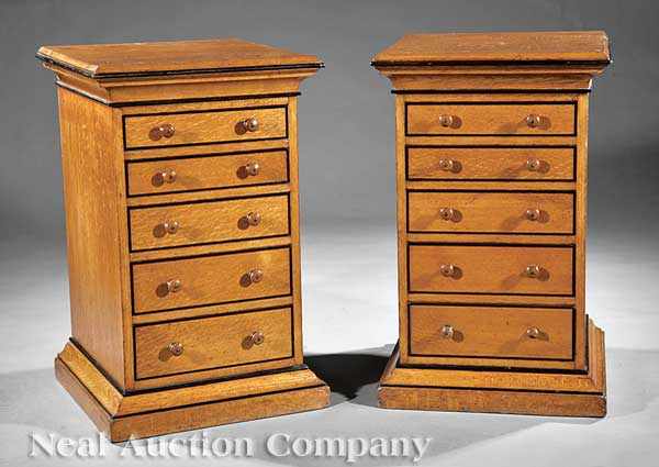 Appraisal: A Pair of Edwardian Oak and Ebonized Pedestal Commodes late