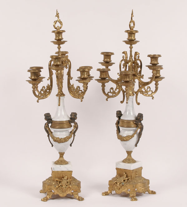 Appraisal: Brass and marble candelabra classical form with cherubs swags shields