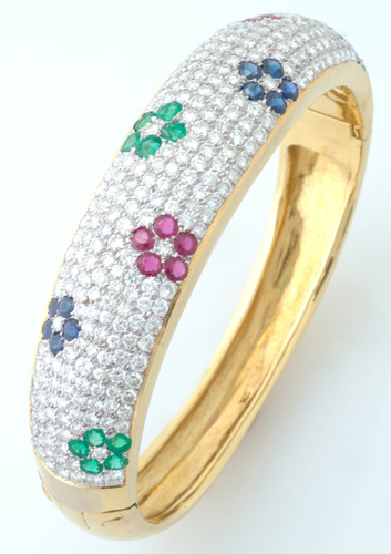 Appraisal: Diamond pav bangle bracelet with floriform clusters of rubies sapphires