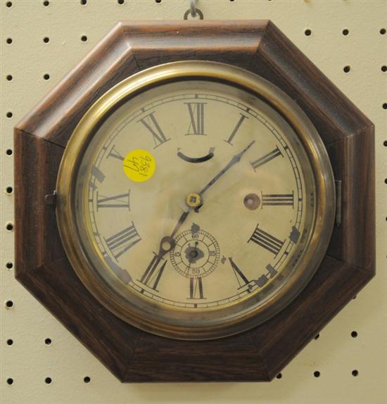 Appraisal: Early octagonal wall clock Waterbury Clock Company oak case roman