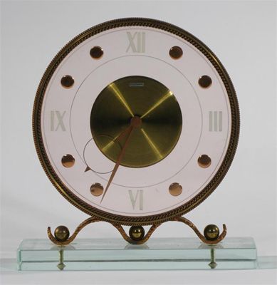 Appraisal: A Mystery clock with copper and brass frame on perspex