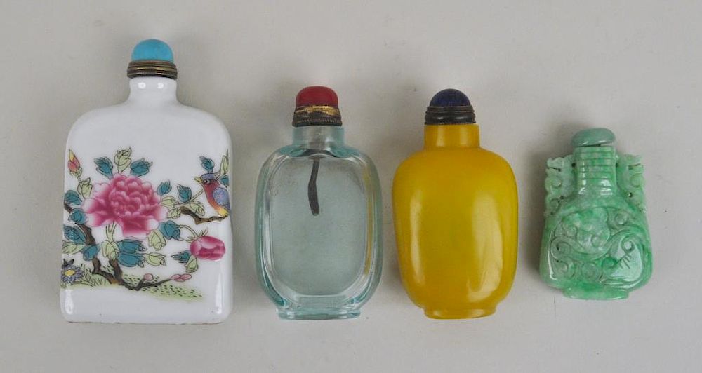 Appraisal: Four Chinese Snuff Bottles comprising two carved Peking glass one