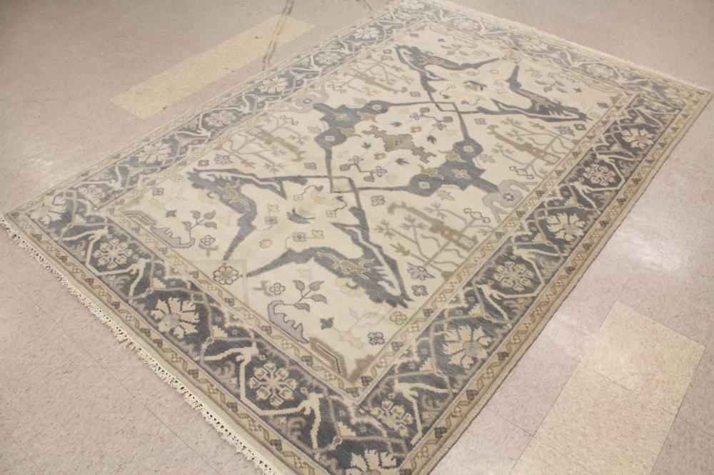 Appraisal: HAND KNOTTED ORIENTAL CARPET Indo-Persian contemporary overall curvilinear floral design