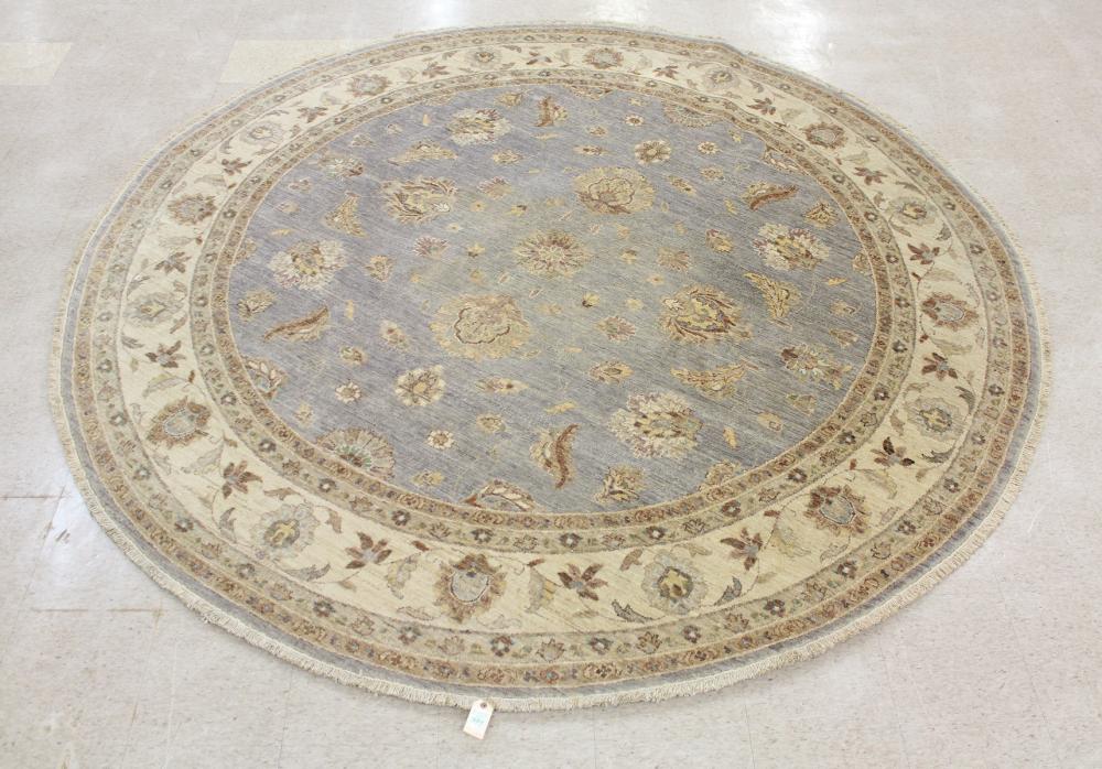 Appraisal: ROUND ORIENTAL CARPET Pakistani Chobi Ziegler overall floral design on