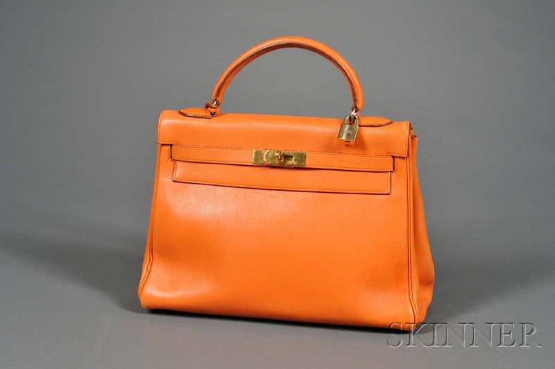 Appraisal: Orange Leather Kelly Handbag Hermes the souple form with goldtone