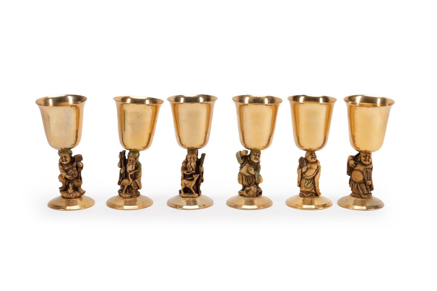 Appraisal: SIX CAROLE STUPELL FIGURAL GOLD TONE GOBLETS Carole Stupell American